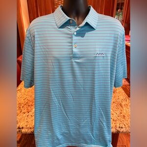 Peter Millar men’s Summer Comfort golf polo. Sharp blue with red stripes & logo.